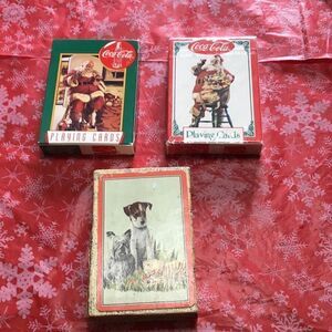 Vintage playing cards two of which are Coca-Cola